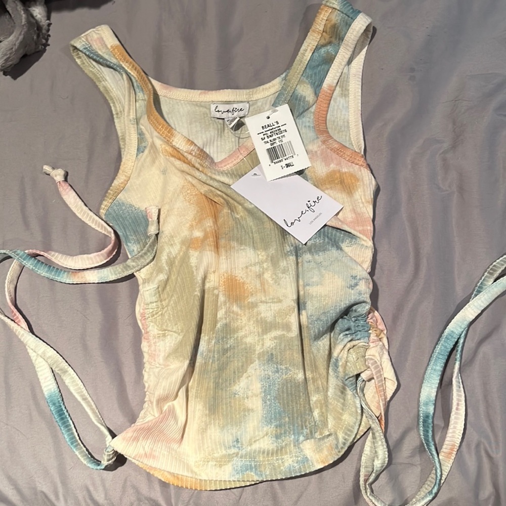 A light colored Tye-dye tang top size X-small women from Beall’s.NEVER WORN!